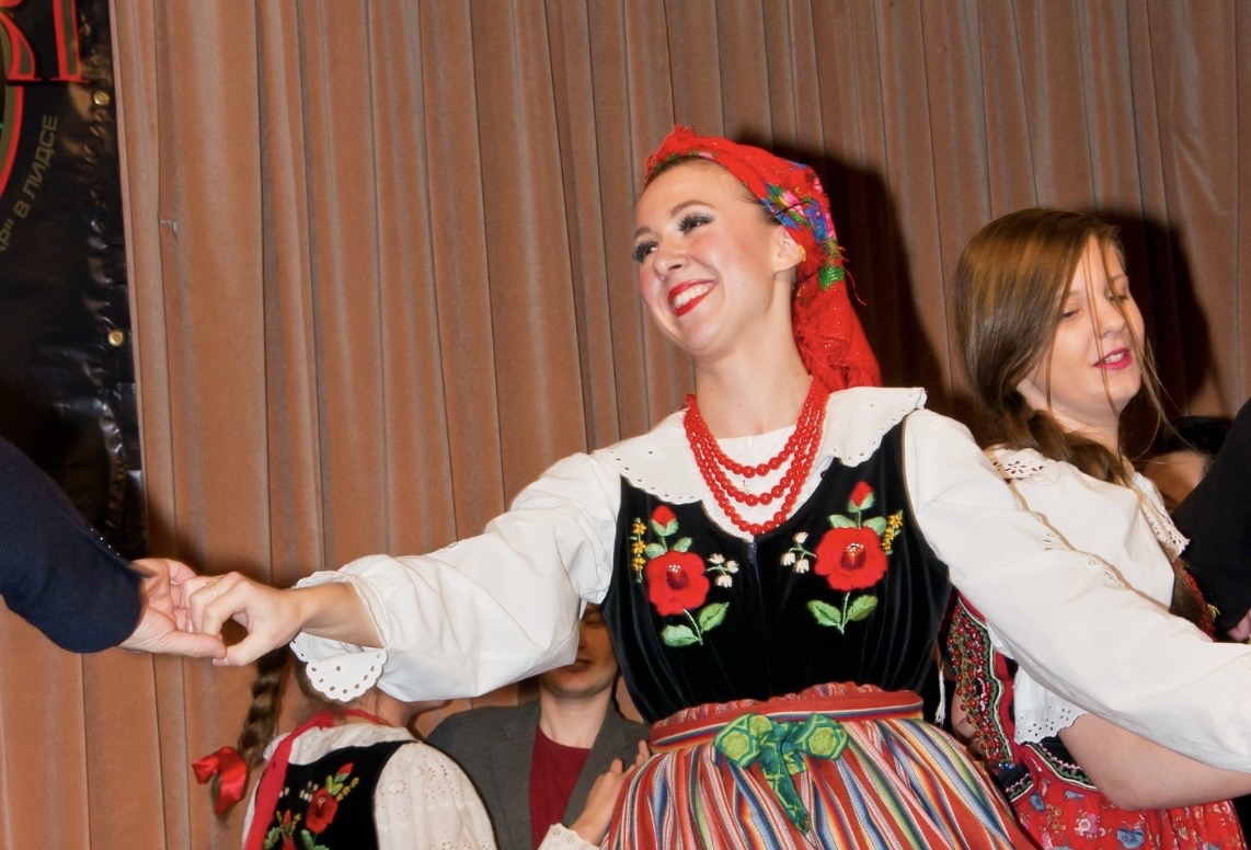 Photo of a woman in folk clothing at a cultural event